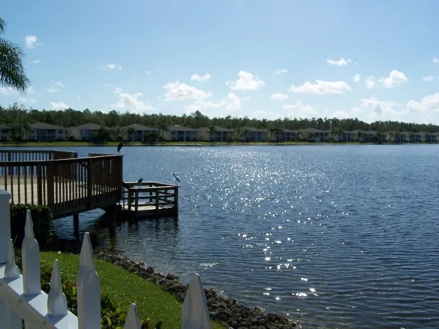 Serene lake at community pool and clubhouse