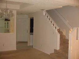 Half Bathroom and staircase leading into the bedrooms.