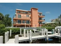 View of the building with the wrap around balconies from the dock