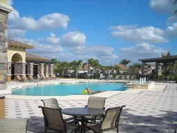 Photo of new master pool and tiki eating area