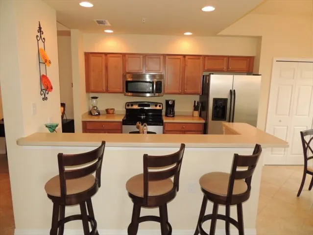 Kitchen features stainless steel appliances and is fully equipped