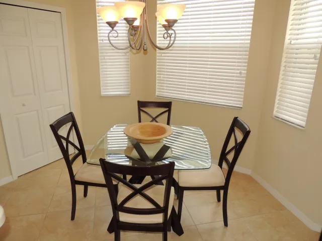 Dining room features bay windows overlooking the golf course