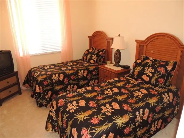 Guest room has two twin beds and a tv