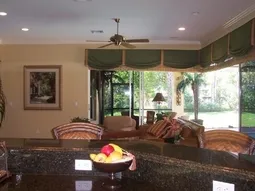 Plush leather couch or comfy seating overlooks pool/lanai