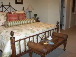 AN elegant Master suite with large closets and classic furnishings