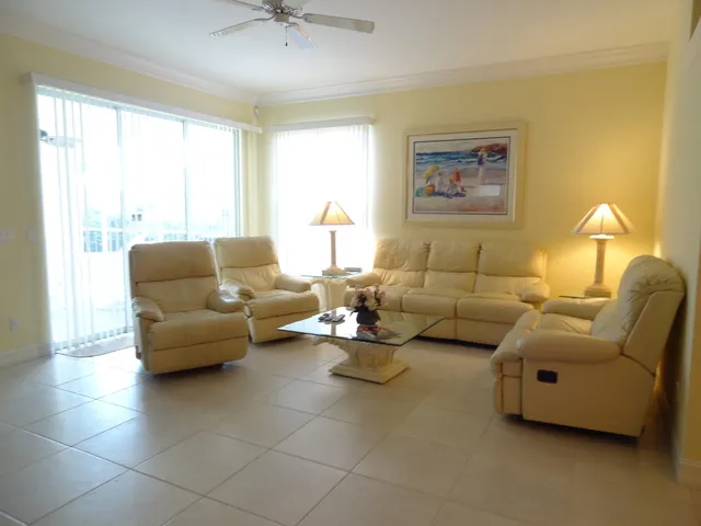 Comfortable living area with plenty of seating and a lovely pool view