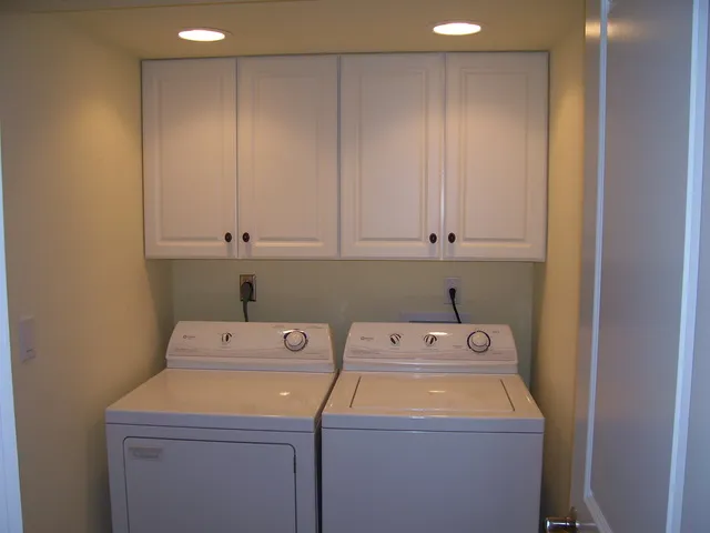 Very nice bright and spacious laundry room in the unit.