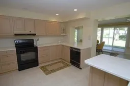 Spacious kitchen is centrally located in the home & is open to the sunroom