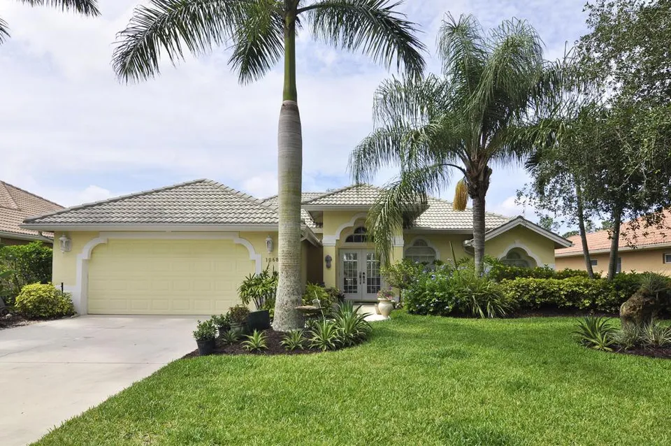 When we built our home we wanted it to reflect the old world Florida style home with sunshine yellow stucco, tile roof and lush landscaping.
