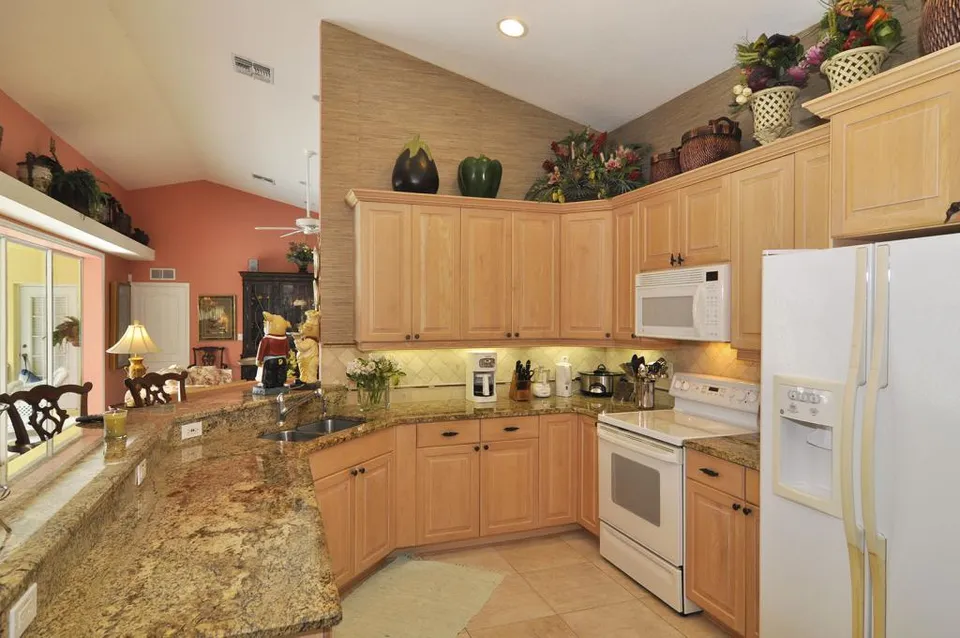 The open Kitchen has granite counters and bar.  Being a baker and cook, the kitchen is equipped with everything you would need and more including food processor, Kitchen-Aid mixer, casseroles, baking pans, etc.  Dine in and cook if you like or dine at any one of the fine restaurants near our home.
