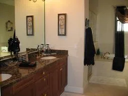 master bath with large walk in closet, jacuzzi jetted tub and large shower