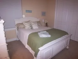 Guest Queen size bed decorated with beach theme.