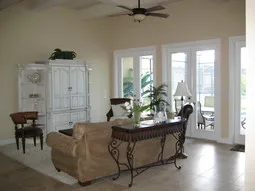 High ceiling Family room with 6 french doors opening out into lanai