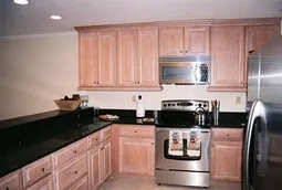 Granite counters, beautiful cabinetry, & stainless appliances