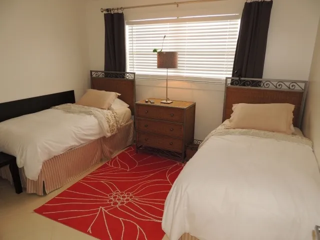 #110 - the two guest rooms each have twin beds and share a hall bath