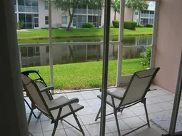 Ceramic tiled, screened easy care lanai for breezy breakfasting!