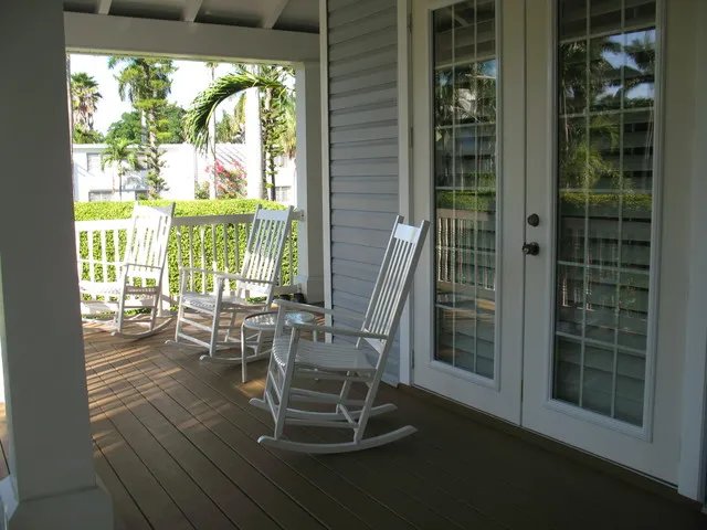 Enjoy the sights and sounds of the beach while relaxing on the verandah