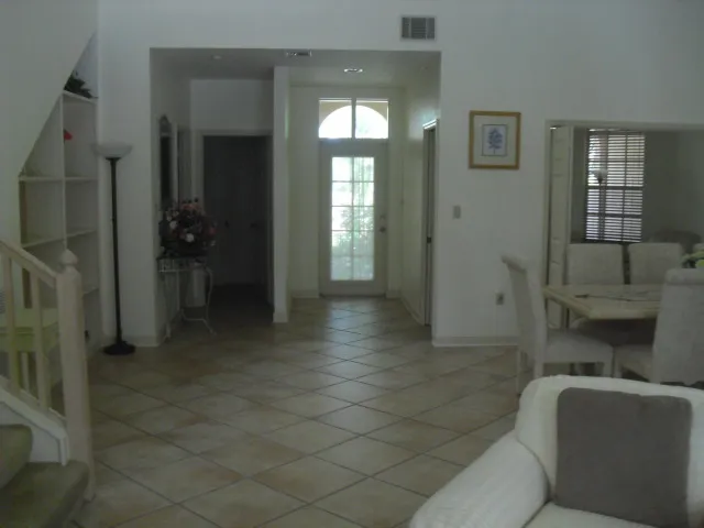 In formal living area facing front door.
