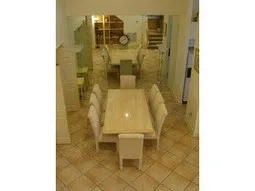 Villa dining with elegant traventine table.