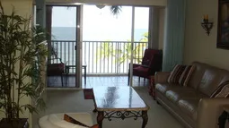 Living Room with Balcony overlooking beach and pool