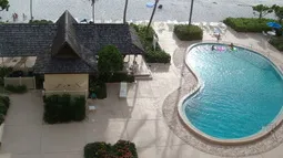 View From Balcony of Pool, BBQ, and Outdoor Dining Area