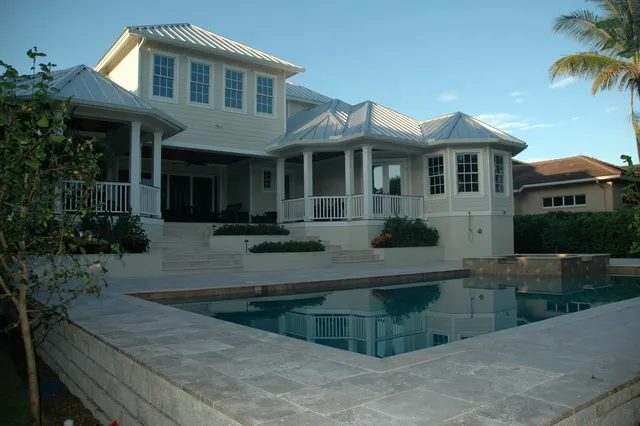 View of the back of our home, with pool in foreground.
