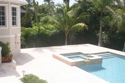 Our large pool, with hot-tub, and outdoor patio.