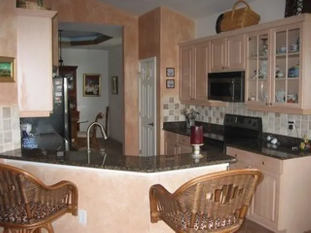Custom Kitchen with granite countertops and stainless appliances
