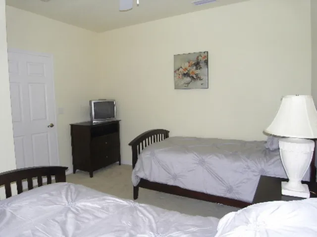 Bedroom 2 with twin beds and TV