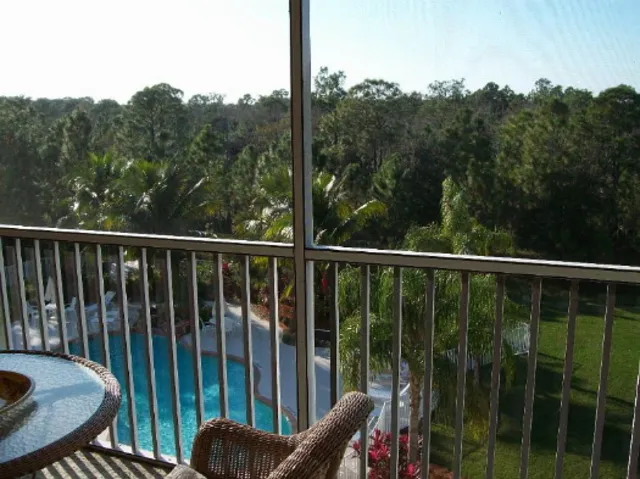 Private balcony overlooks pool and Pinic area
