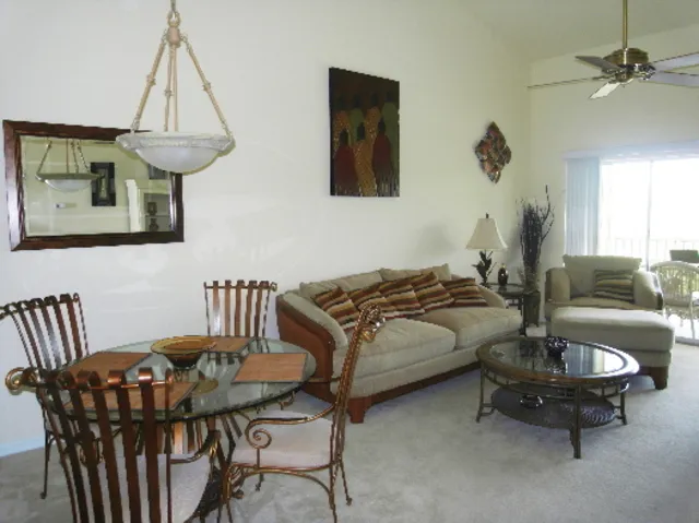Main living area with 14Â½' ceilings with seating for 4 and formal dining 