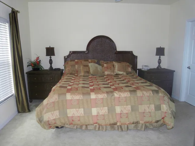 Master Bedroom with 6' king bed, LCD TV, own bathroom and doors to balcony 