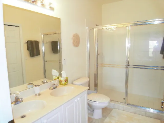 Master bathroom with large walk in shower and 5Â½ x 6Â½ walk in wardrobe 