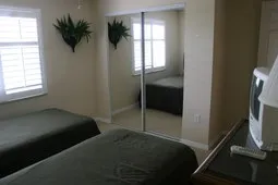 Guest BR with twin beds, lg. closet with access to bathroom.
