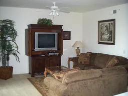 A spacious and comfortable living room, just a few steps to the lanai.