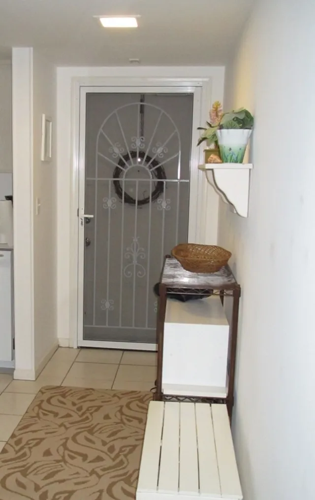 Front Entrance has decorative screened door