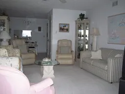 Livingroom has lots of comfy seating + extra sleeping with a fold out couch