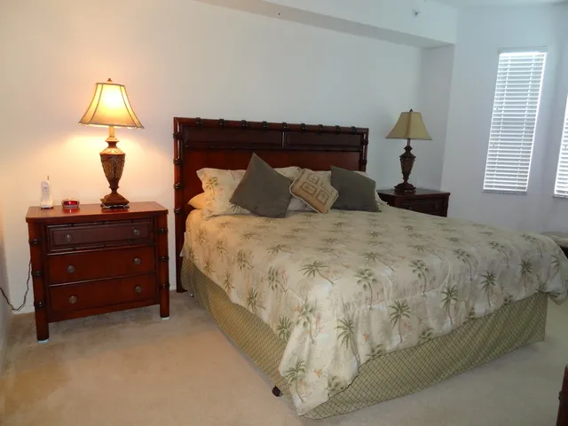 Master bedroom suite with king size bed, walk-in closets and private bath