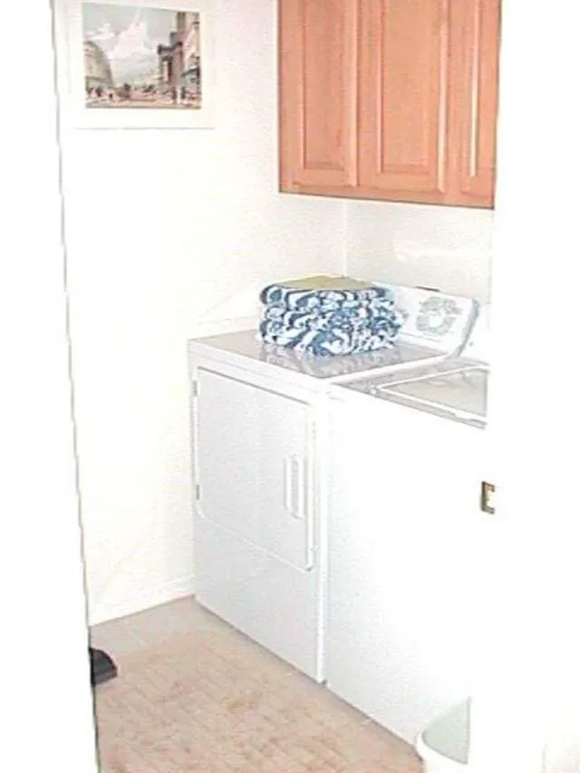 Laundry room with full sized washer and dryer