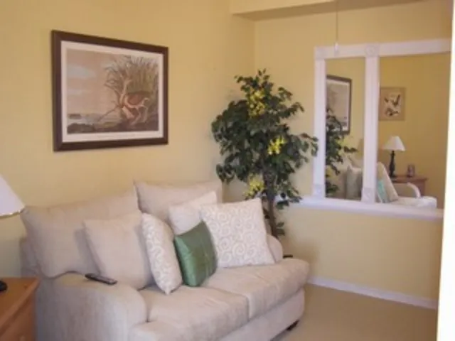 Nice large den with seating and a television.