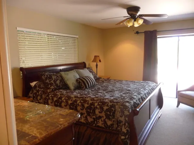 Master Bedroom, King Bed, Private Bath, Flatscreen TV, opens to the pool.