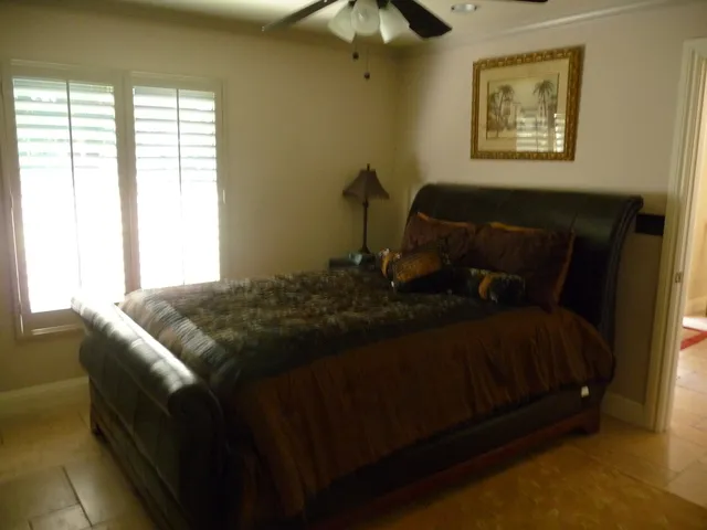 Queen Bedroom with private bath, flat screen TV, office area.