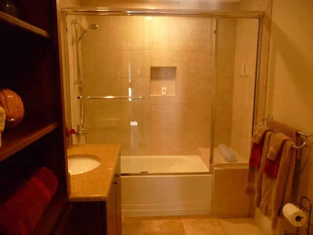 Queen bath, glass shower, granite counters.