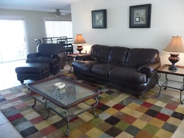 Living room with all leather furniture and 52 inch flatscreen television.