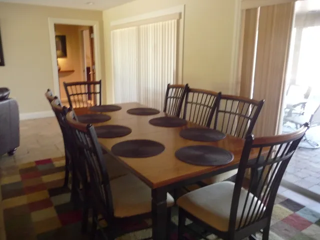 Dining Room Table, seats 8, overlooks pool.