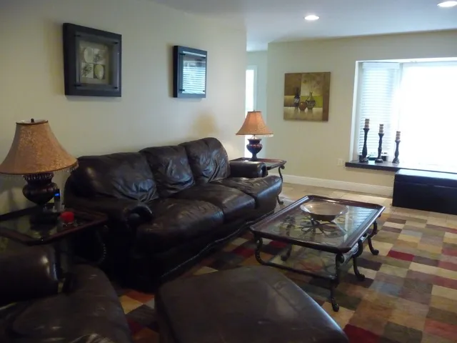 Living Room, all leather furniture, 50 inch flat screen TV.