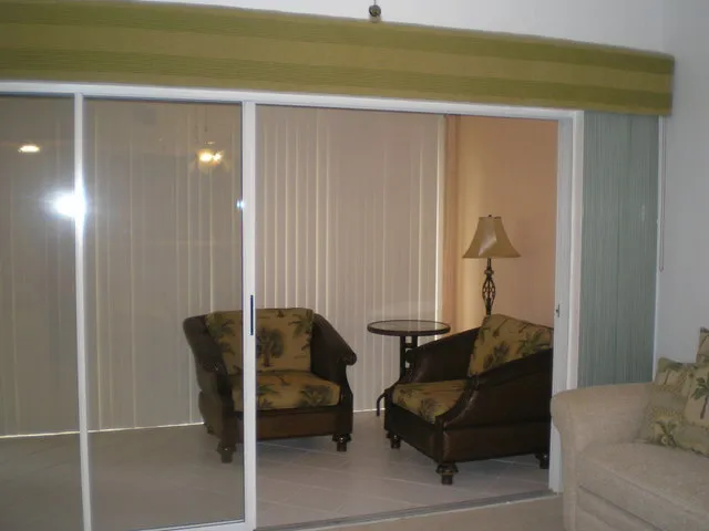 Enclosed Lanai with Tommy Bahama seating area.
