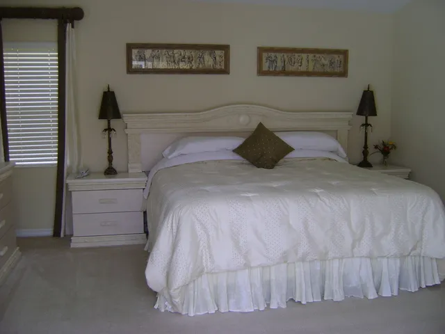 Master bedroom with ensuite facilities,looking on to swimming pool & lake.