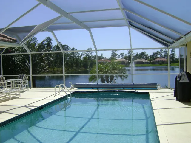 Large private pool area and sun terrace looking on to lake