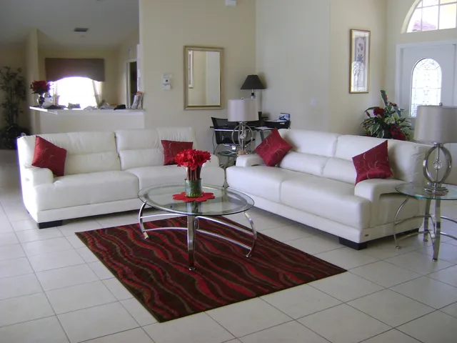 Beautiful living area looking out on to swimming pool and lake